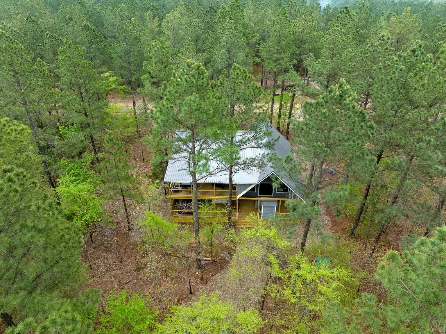 Aerial view of cabin in the pines