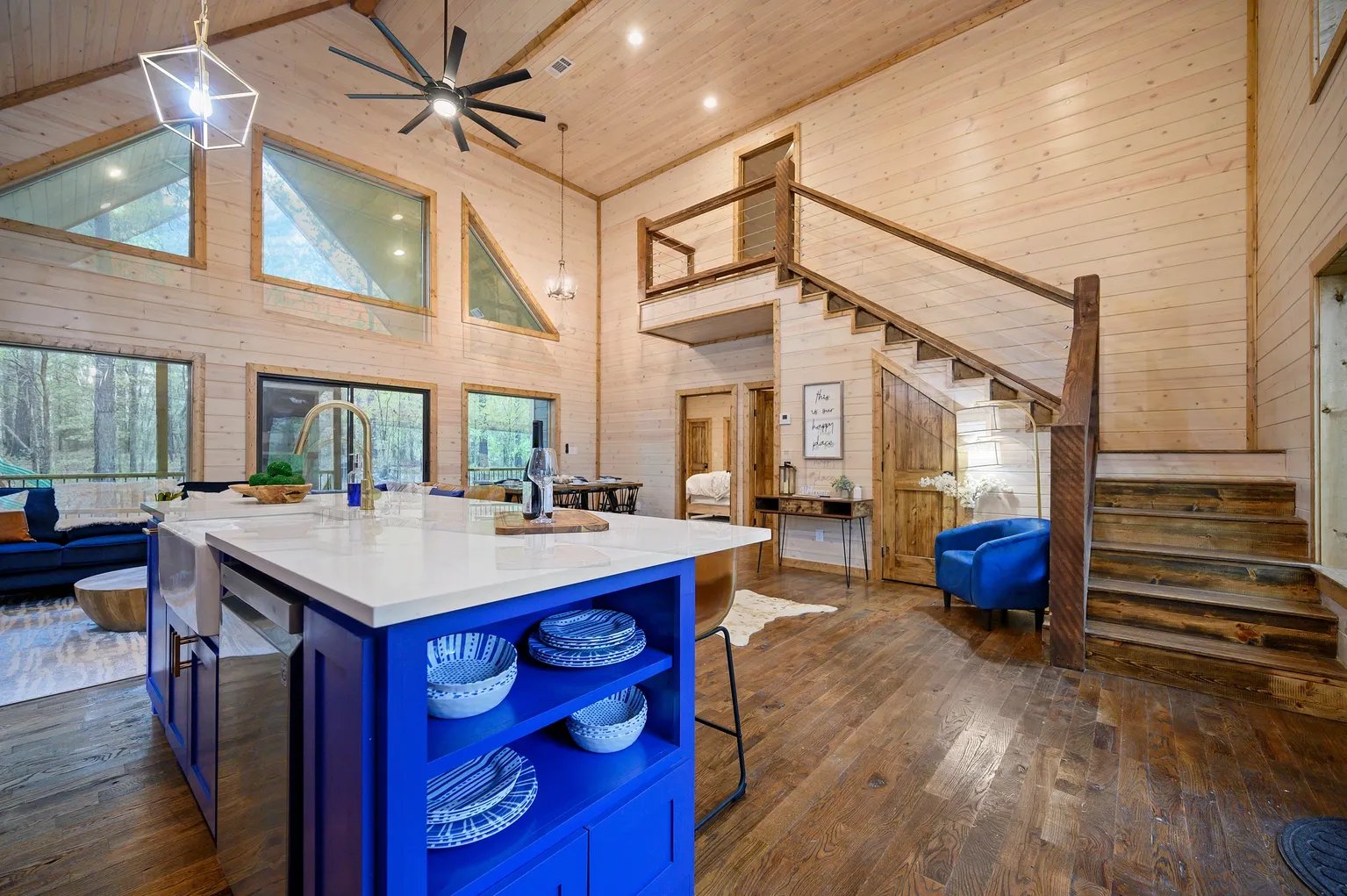 Blue kitchen island with staircase