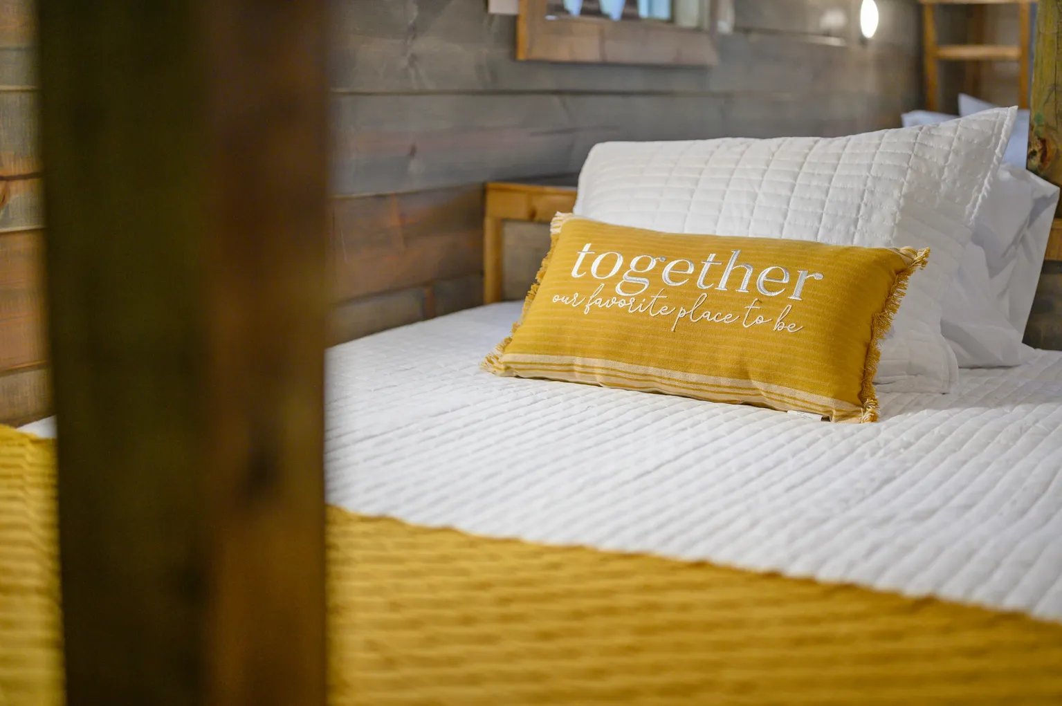 Together pillow detail on bed